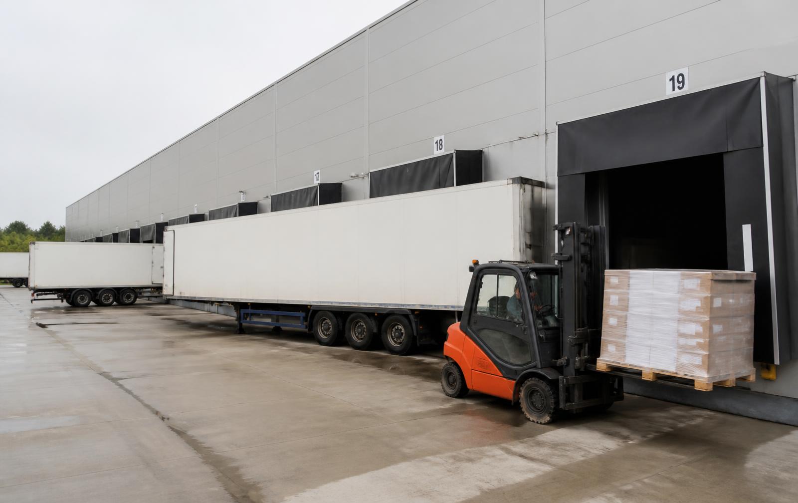 Illustration of trucks at an industrial loading dock